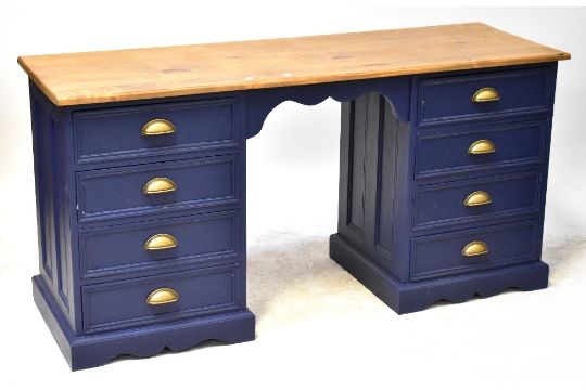 A twin pedestal desk with varnished top and painted blue base, each pedestal with four drawers, - Image 1 of 2