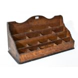 An oak waterfall vertical pigeonhole desk tidy/organiser with four rows of pigeonhole compartments,