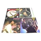 A quantity of records to include The Beatles '1962-66' and 1967-70', both reissues,