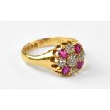 An 18ct gold diamond and ruby ring,