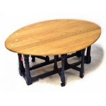 An oak drop-leaf gateleg occasional table with blue painted base, 50.5 x 122 x 88cm when extended.