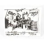 EARTH WIND AND FIRE; a promotional black and white photograph bearing numerous signatures.