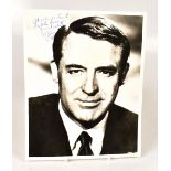 CARY GRANT; a black and white photograph of the famous actor, bearing the star's signature,