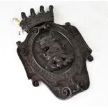 A bronzed plaster plaque decorated with an armorial for Cholmondeley, 44.5 x 28cm.