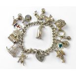 A vintage hallmarked silver charm bracelet united with hallmarked silver heart-shaped padlock clasp,