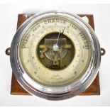 An early 20th century German ship's bulkhead barometer inscribed to the silvered dial 'Franz Happe