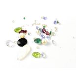 A collection of various loose gemstones which were previously mounted in jewellery,