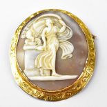 A large 19th century carved shell cameo brooch, depicting Leda and the Swan,