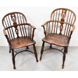 A near pair of Georgian ash and elm open-arm Windsor chairs,