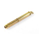 A vintage 9ct gold pocket toothpick, with knurled finish and hoop to the top, length approx 4.