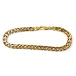 A 9ct flat curb bracelet, length approx 20cm, approx 12.7g.