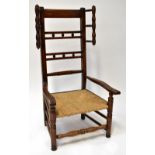 A late 18th/early 19th century rush seated low chair with high back,