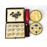 A cased set of twelve Edwardian diamanté buttons,