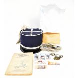 A French blue and white Gendarme-style cap and an ADE Courcy & Co Frankport Street,