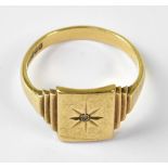 A gentlemen's vintage 9ct gold signet ring, with central tiny diamond in a star cut design,