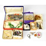 A small mixed lot of costume jewellery to include a white metal filigree bracelet,