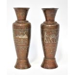 A pair of bronze-coloured metal vases with white metal Egyptian figural and hieroglyphic decoration,