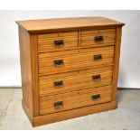 An Edwardian satin walnut chest of two short over three long drawers, on plinth base,