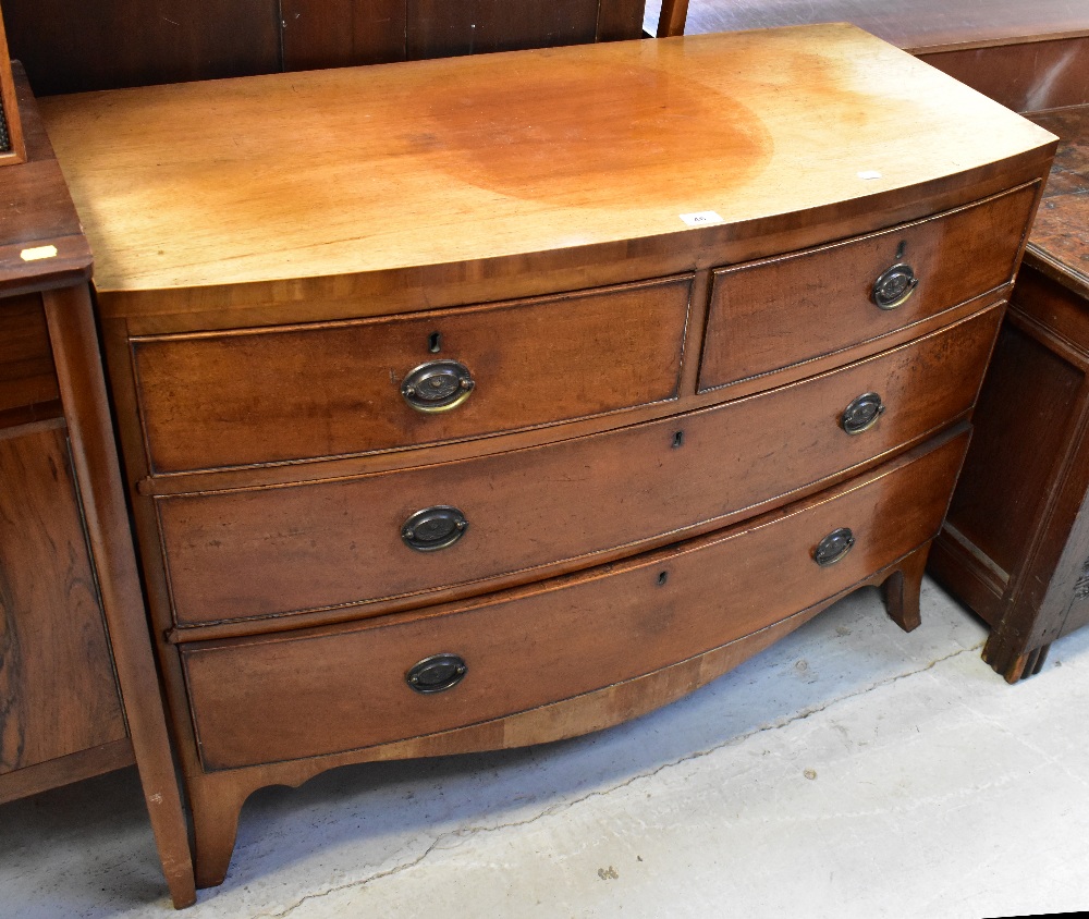 A Georgian mahogany bow-fronted chest of two short and two long drawers,