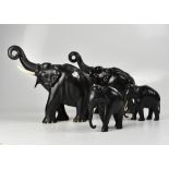 Four Oriental carved elephants with bone tusks, various sizes (4).