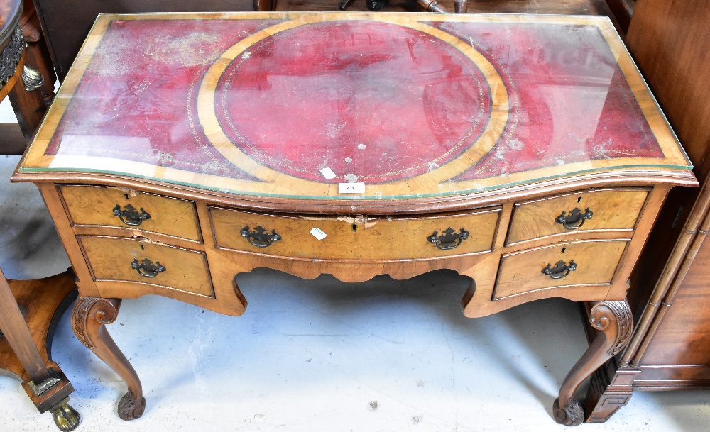 A reproduction walnut Georgian-style serpentine fronted lowboy,