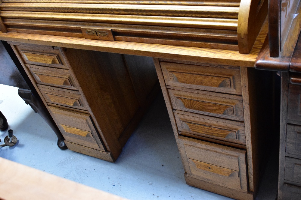 An early 20th century oak roll-top desk, the upper tambour section above twin pedestals, - Image 3 of 3