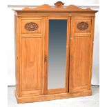 An Edwardian satin walnut triple wardrobe,