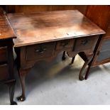 A 19th century oak lowboy, the moulded top above three frieze drawers and shaped apron,