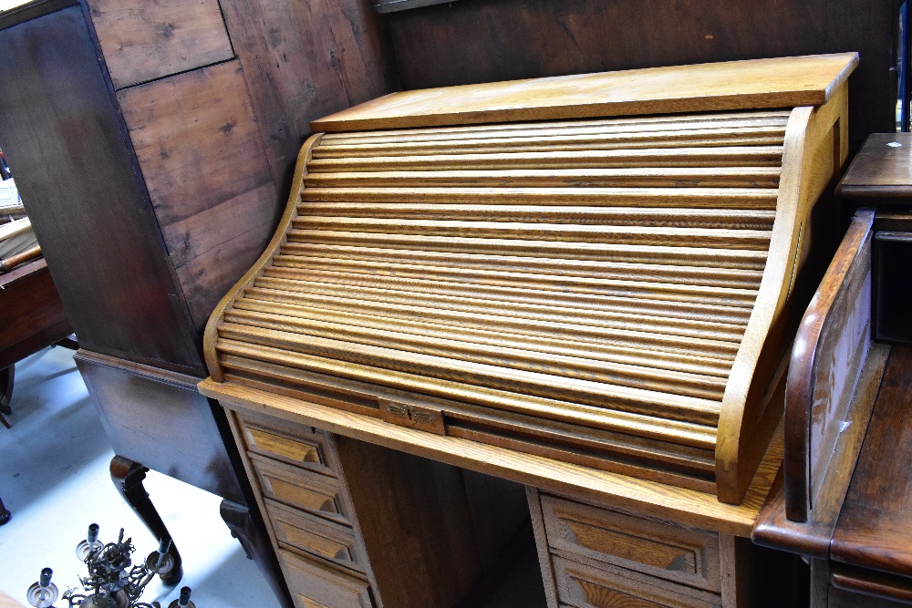 An early 20th century oak roll-top desk, the upper tambour section above twin pedestals, - Image 2 of 3