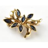 A 20th century 9ct gold and sapphire leaf floral brooch, approx 2cm, approx 1.7g.