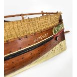 An early 20th century hand painted wooden model boat, with weighted hull, on associated stand,