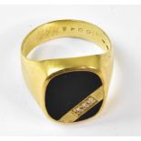 A yellow metal gentleman's signet ring with onyx top and three small diamonds, size T, approx 6.5g.