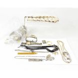 Various items of costume jewellery to include a white metal torc bangle,