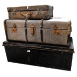 Two early 20th century travel trunks comprising a black metal example and a card example with metal