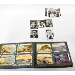 A mid-20th century postcard album containing coloured and black and white photographs,