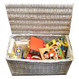 A large white painted wicker hamper containing a large quantity of mainly vintage Fisher Price