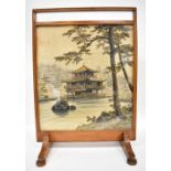 A late 19th/early 20th century Chinese fire screen with inset hand painted scene depicting