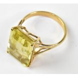 A gold and citrine dress ring, the emerald cut citrine approx 1.56 x 1.