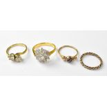 Four vintage fashion rings, to include a 9ct gold white stone crossover ring, size L,