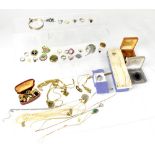 A large quantity of vintage and contemporary costume jewellery to include many silver items, rings,