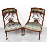 A pair of Edwardian inlaid mahogany low salon chairs,
