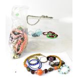 A quantity of costume jewellery to include necklaces, earrings, etc.