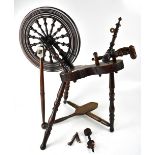 A 19th century oak spinning wheel, height 74cm (af).