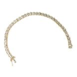 A 9ct yellow gold tennis bracelet with thirty-eight illusion set small diamonds, approx 7.4g.