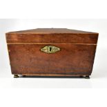 A 19th century mahogany tea caddy of rectangular form and angled top,