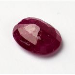 A loose 4.30 carat oval ruby with AGI insurance valuation.