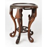 A late 19th/early 20th century Chinese mahogany vase stand,