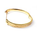 A modern 9ct gold bracelet with concave recessed band to centre,