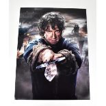 THE HOBBIT; a large format reproduced photograph bearing the signature of Martin Freeman, 41 x 30cm.