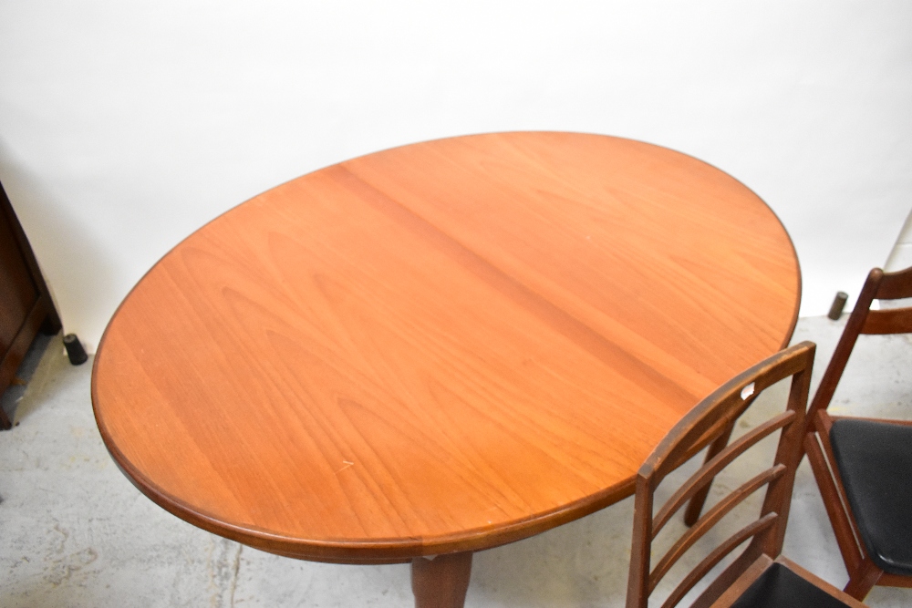 A 20th century teak oval extending dining table on tapering legs, approx 74 x 140 x 100cm, - Image 4 of 5